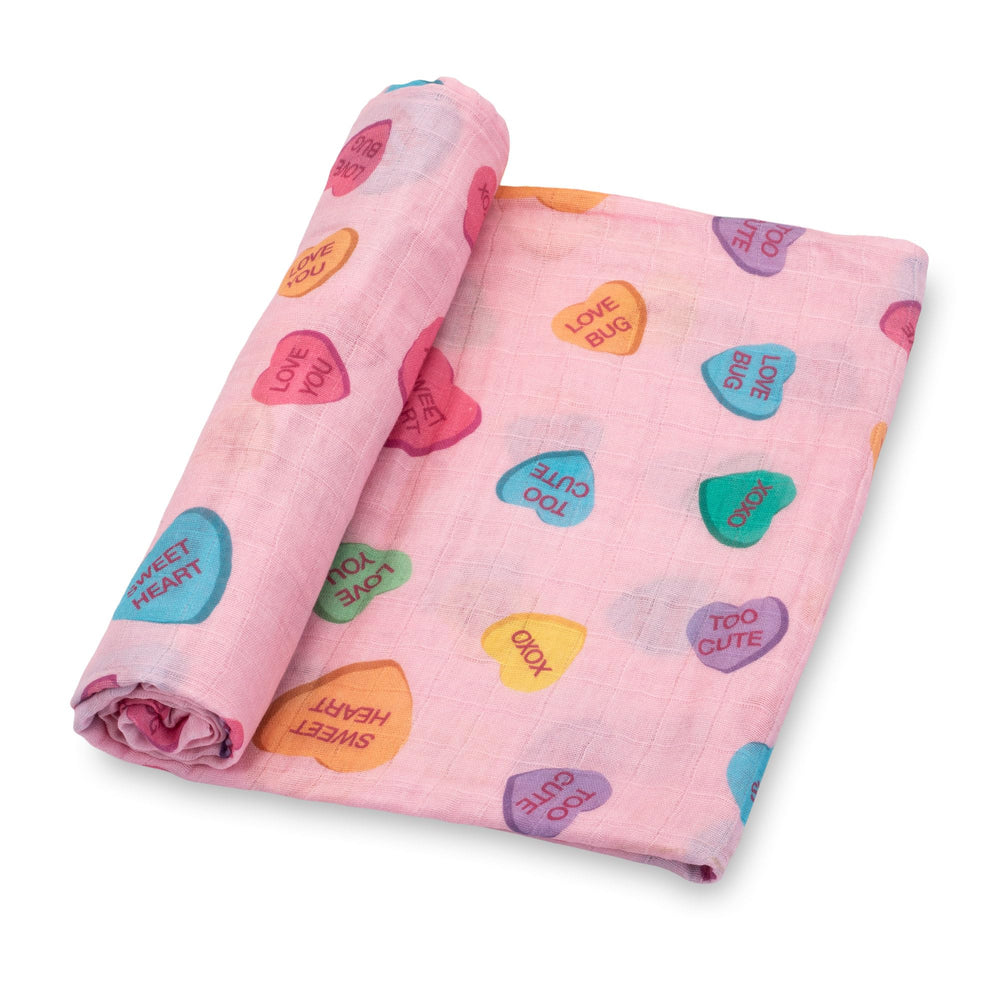 LollyBanks baby blanket heart print flatlay shows soft muslin for gentle snuggles.