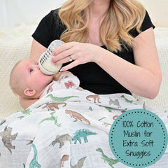 LollyBanks dinosaur-blue swaddle blanket closeup highlighting breathable cotton muslin.