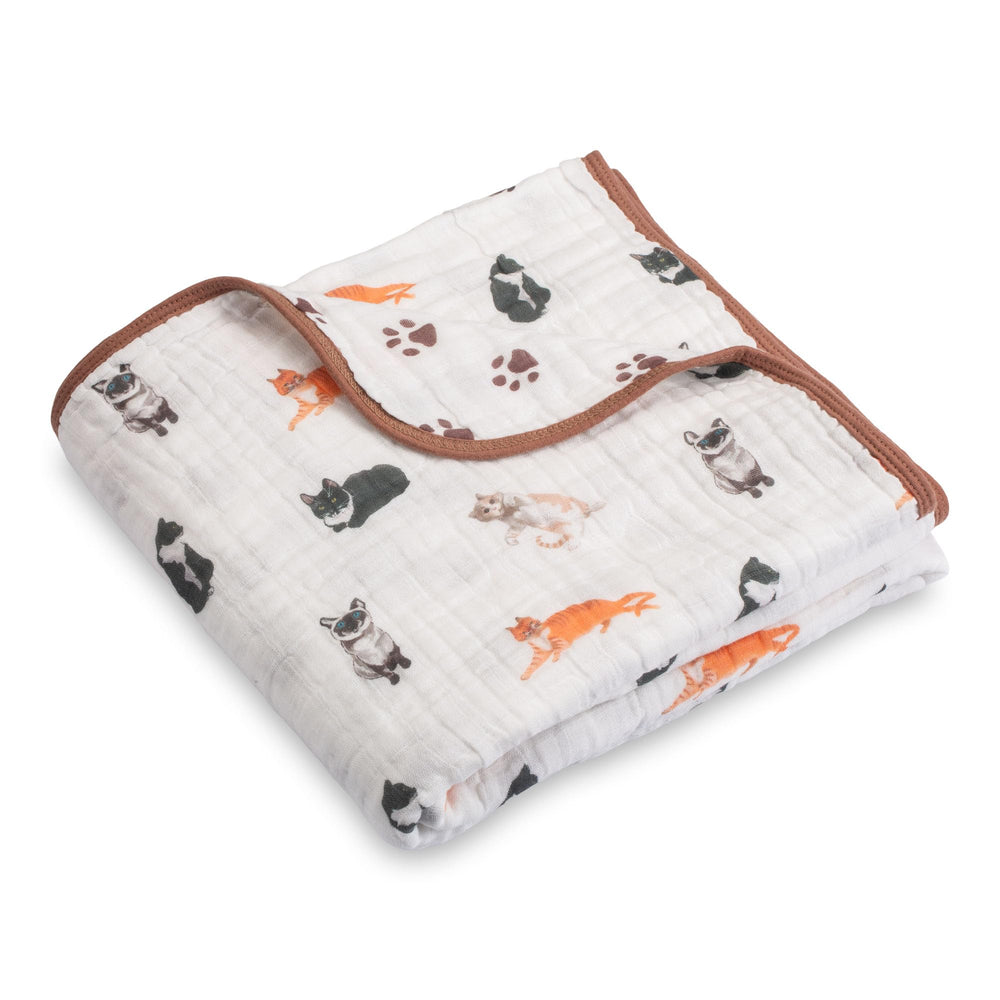 LollyBanks cat-print muslin blanket closeup highlighting soft cozy nursery mood.