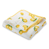 LollyBanks muslin baby quilt sunny lemon print adds cheerful nursery warmth.