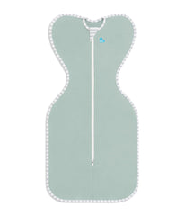 Love to Dream Swaddle Up Olive baby sleeping scene highlights calm rest.