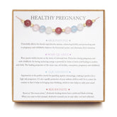 LOVEMY healthy pregnancy bracelet close-up Moonstone glow for calming energy.