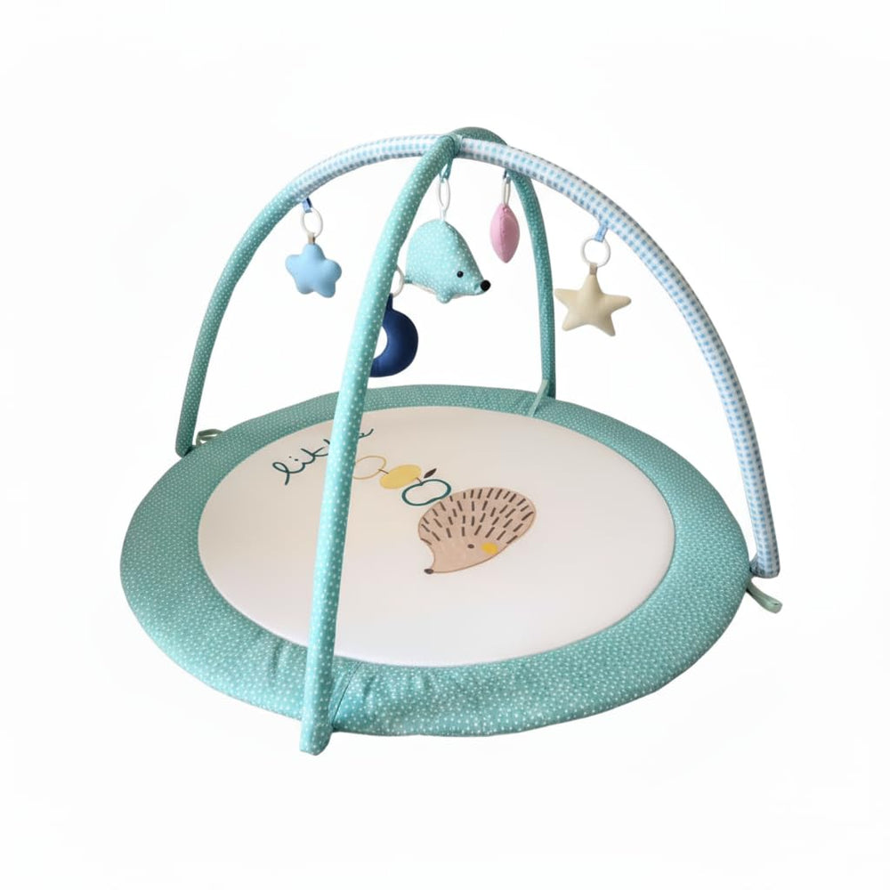 LULLABY COTTON play gym overhead arches provide a soft, safe space for newborn exploration.
