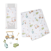 Lulujo Golf Swaddle blanket close-up shows soft muslin for gentle newborn swaddling comfort