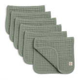 Lululamb six-layer muslin burp cloths folded, highlighting absorbency for drool and spills.