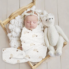 Lulumoon baby muslin swaddle blanket fabric closeup reveals breathable 100% cotton texture.