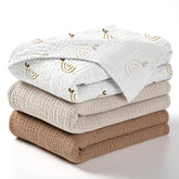 Lulumoon baby muslin swaddle blanket rainbow brown packaging shows gift-ready presentation.