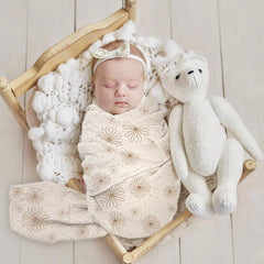 Lulumoon baby muslin swaddle blanket SandDaisy close-up shows breathable cotton texture