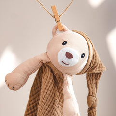 Lulumoon bear lovey travel-use scene emphasizes portable comfort.