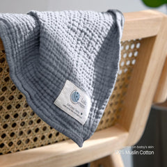 Lulumoon multi-use nursing cover with grey swaddle for privacy and versatility.