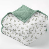 Lulumoon muslin blanket with Lotusleaf Tree print offers breathable baby comfort.