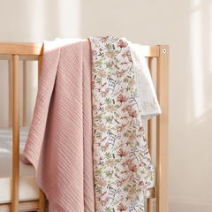 Lulumoon Muslin Swaddle Blanket 40x40 inches demonstrates generous size for secure wrapping.