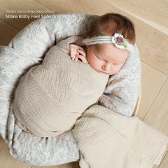 Lulumoon Muslin Swaddle Olive wrapped baby demonstrates snug, secure swaddle.