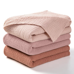 lulumoon Muslin Swaddle Chestnut pack-front shows lightweight, breathable comfort for newborn calm