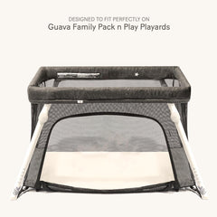 lulumoon snug-fit elastic-edge sheets secure a Guava Family Pack n Play during movement.