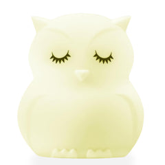 Lumipets Junior Owl night light glows softly on bedside table for bedtime calm.