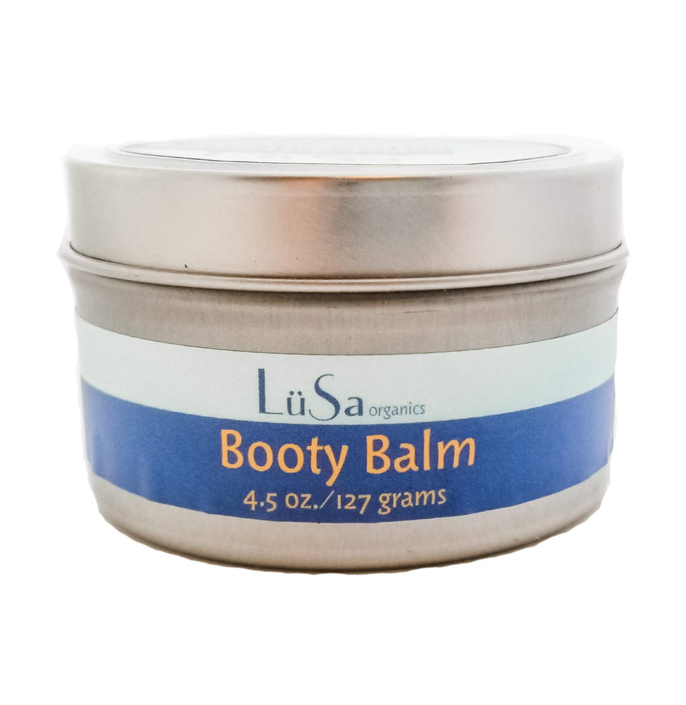 Lusa Organics Booty Balm tin closeup for soothing baby skin and diaper rash relief.