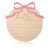 Lusofie baby announcement sign with pink bow for photo moments.