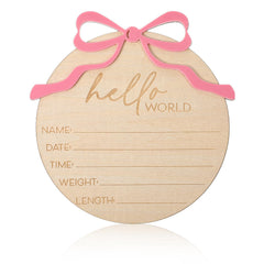 Lusofie baby announcement sign with pink bow for photo moments.