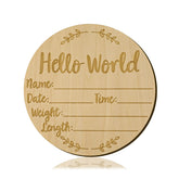 LUTER baby-announcement-sign hello world round on wood, perfect for newborn milestone photos.