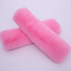 Lutoku pink seatbelt covers on stroller and car seat, easy on-the-go comfort.