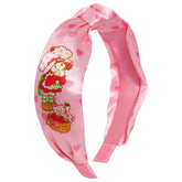 LUV HER licensed Strawberry Shortcake headband closeup with vibrant colors for playful styling.