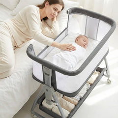 Luvkixen 3-in-1 bedside sleeper beside parent for night feeds.
