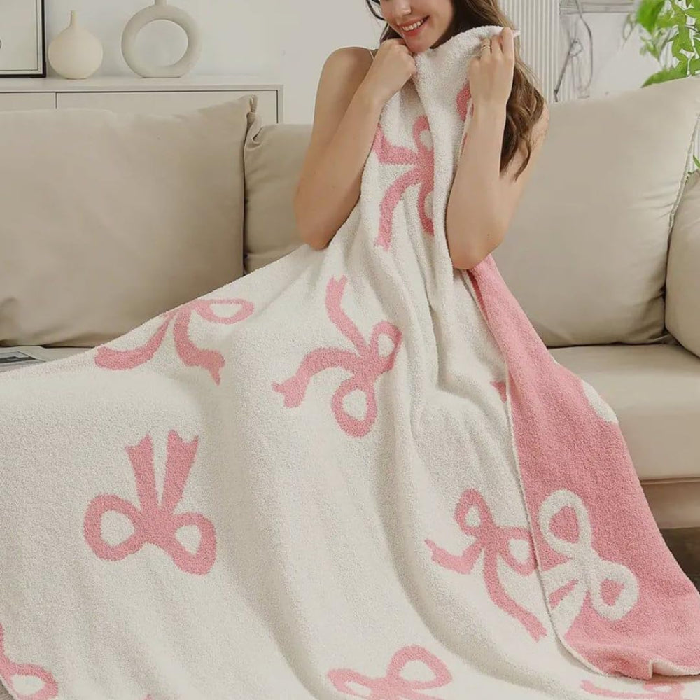 Luxape Bow Blanket pink bows close-up, plush texture for newborn warmth