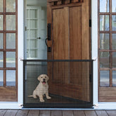 LWFCOEE mesh dog gate on a doorway provides a safe boundary for pets.