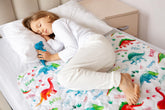 Lynmark Potty-Training Mattress Protector Dinosaur top closeup showing quilted softness for comfort