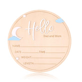 Lyreh wooden baby announcement sign round moon-and-stars motif for chic nursery decor and birth details.