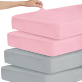 Magik & Kover Stretchy Crib Sheet grey-pink folded for easy swaps
