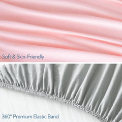 Magik & Kover Stretchy Crib Sheet grey-pink on mattress showing deep pocket