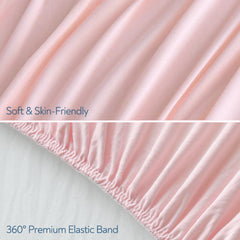 Magik & Kover pink stretchy crib sheet on mattress highlights snug fit for crib and toddler bed.