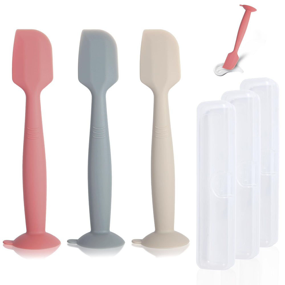 MAIKKB diaper spatula with suction base stands upright for quick access.