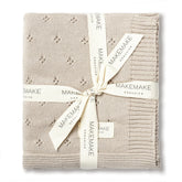 MakeMake Organics baby blanket beige-knit close-up highlights ultra-soft organic cotton for sensitive skin.