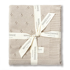 MakeMake Organics baby blanket beige-knit close-up highlights ultra-soft organic cotton for sensitive skin.