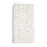 Makemake Organics changing pad cover in herringbone offers soft, skin-friendly comfort during diaper changes.