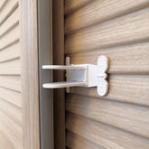 Makibi sliding-door-lock closeup shows compact one-hand operation.