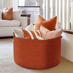 Maliton basket with sturdy handles for easy moving laundry.
