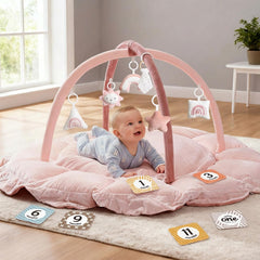 Mallify 5-in-1 baby gym pink ball-pit with plush surface supports tummy time.