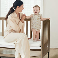 MAMAZING EvoNest adjustable-height crib demonstrates multiple mattress heights
