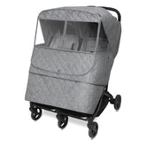 Manito Melange weather shield outer layer provides rain and wind protection for twin strollers.