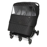 Manito Melange weather shield for twin strollers with water-repellent exterior protecting from rain.