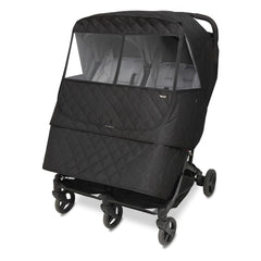 Manito Melange weather shield for twin strollers with water-repellent exterior protecting from rain.