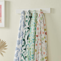 Margaux & May muslin swaddle soft-fold shot, airy fabric wraps baby comfortably.