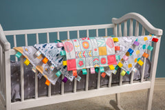 Mary Meyer Taggies Original Blanket satin loop tags for tactile exploration and soothing sensory play.