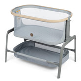 Maxi-Cosi Iora bassinet side view demonstrates portable bedside design for close baby proximity.