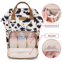 MCWTH cow-print diaper bag backpack wide opening design for quick item access.