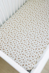 Mebie Baby Autumn Bloom muslin sheet fits standard crib mattresses securely.